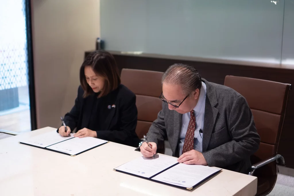 Pathama Sirikul, President of ThaiCham Indonesia, and Adam Goh, Deputy CEO of Unionspace & InvestinAsia, at the signing of the MoU in Jakarta on June 29, 2026. (Photo courtesy of InvestinAsia)
