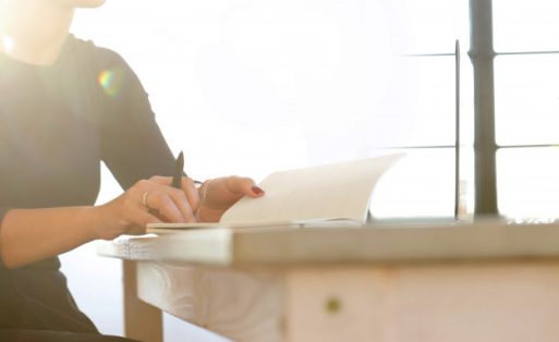 young-woman-working-with-laptop-agenda_144627-30277